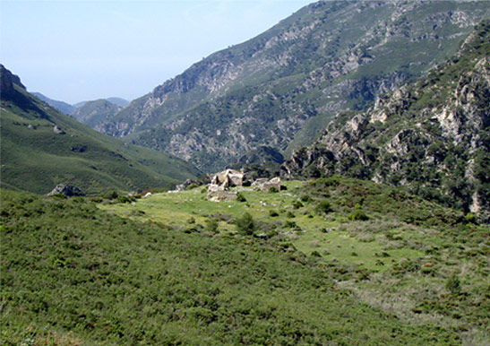 A spectacular mountain scene with a ruinous cortijo lying abandoned in the high sierra.